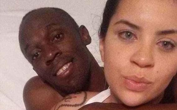 Usain Bolt has been photographed in bed with a Brazilian student in Rio